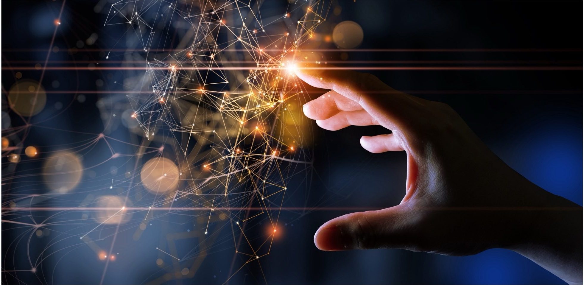 A hand reaches out to touch a glowing network of interconnected points and lines, symbolizing digital technology, connectivity, or data interaction, with a dark and blurred background.